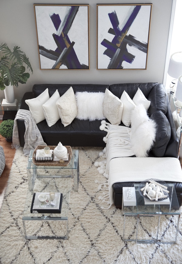 Chic Family Room Design and Decor Ideas. Wall art, sectional sofa, pillows, throw blanket, coffee table, area rug, interior design, neutral, elegant.