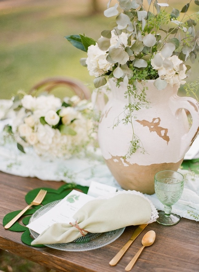 Modern farmhouse St. Patrick's Day tablescape idea with shamrock menu cards.