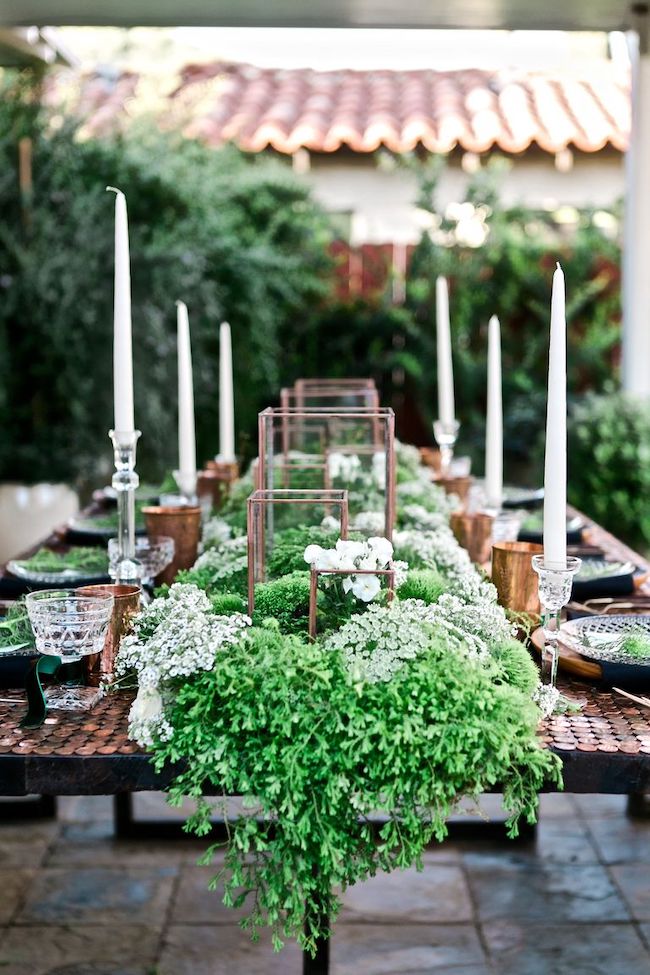 Copper and green St. Patrick's Day Table Decor Idea with florals, ferns and moss.