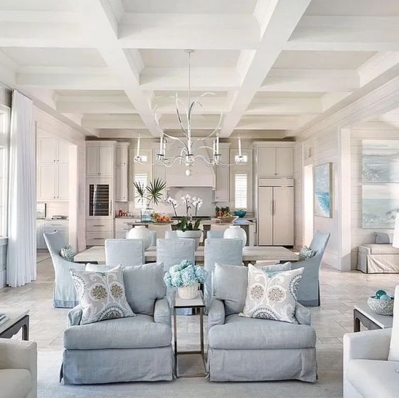 Make a home look cohesive. Coordinated paint color scheme in open concept living room, dining room, kitchen. Blue and white.