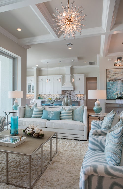 Beach style living room- open concept design with kitchen. Cohesive style. Pulled together look.