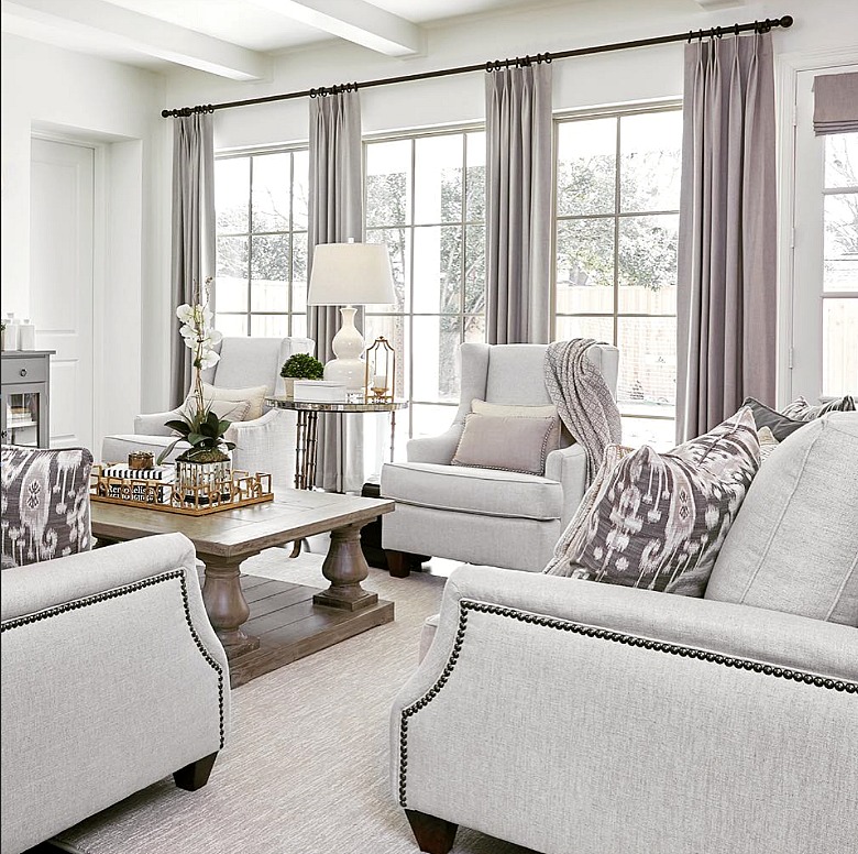 Light gray furniture in a transitional modern living room. Elegant. Bright.