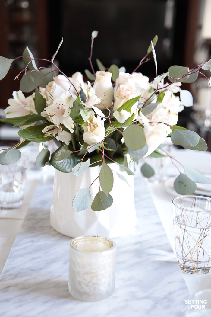 DIY tutorial to make a marble table runner to display vase of flowers and votive candle holders.