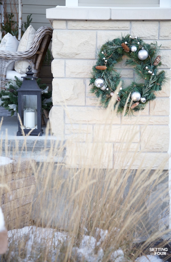 Learn how to create this neutral Christmas porch decor ideas to adorn your home for the holidays!