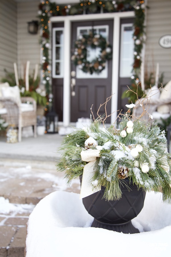 Learn how to create this festive, elegant & neutral Christmas porch decor ideas to adorn your home for the holidays!