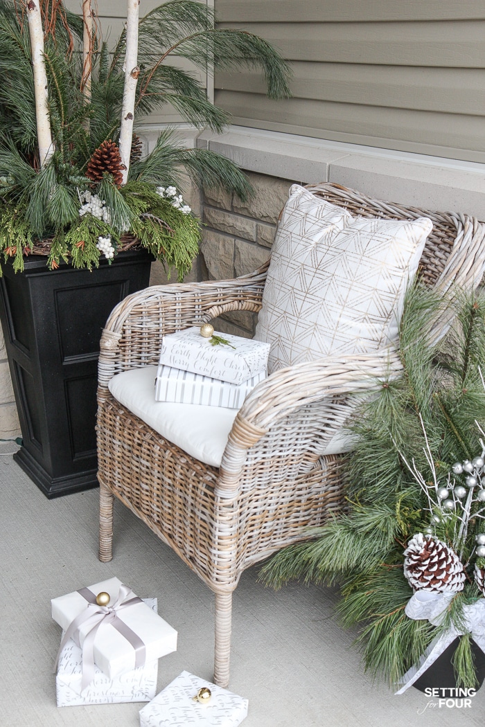 Neutral and Elegant Christmas Porch Decor Ideas! Christmas pillows and porch seating.