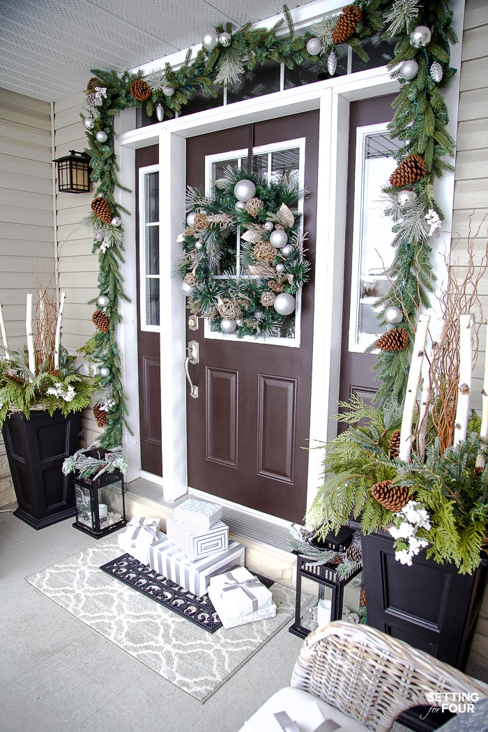 Neutral and Elegant Christmas Porch Decor Ideas! Christmas wreath, garland and planters.