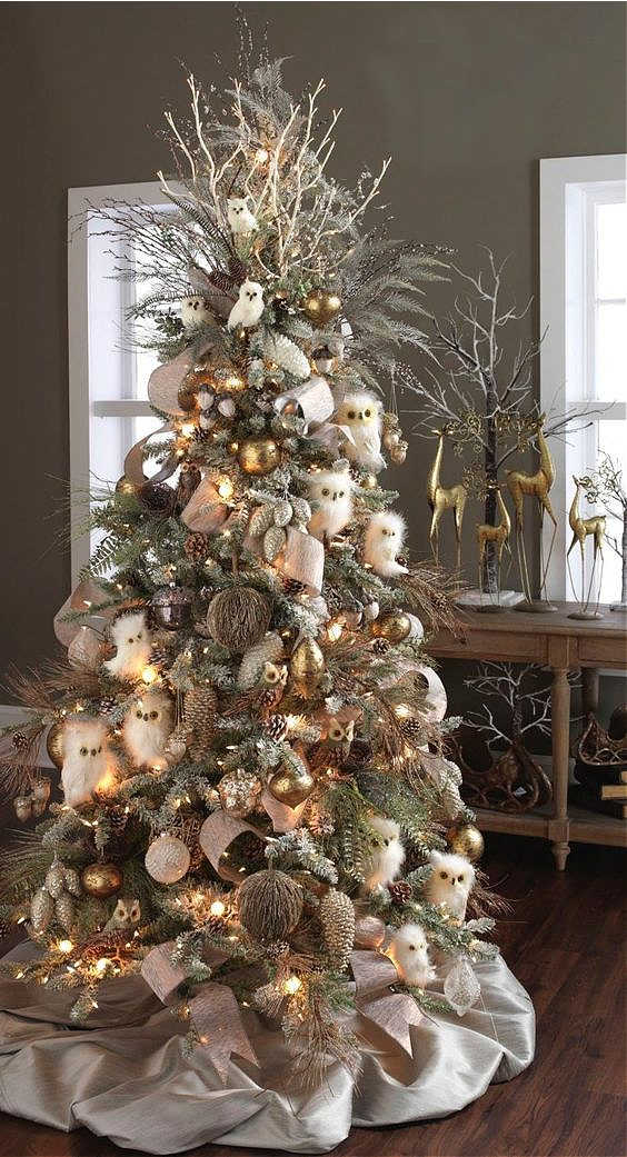 Elegant Rustic Woodland Christmas tree with owl ornaments, pinecone ornaments, twigs, ribbon, pine sprays and picks.