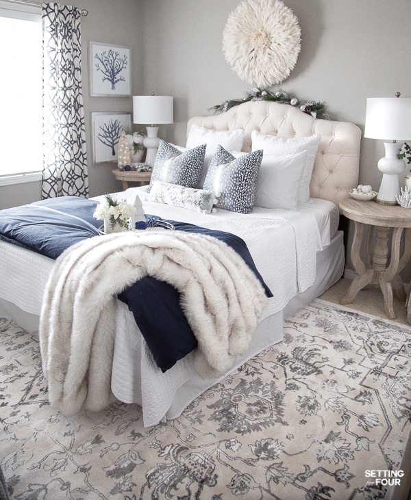 Chic Bedroom Design and Decor Ideas. blue and white color scheme. Modern, elegant. Bed, wall decor, wall art, area rug, table lamps, nightstands, drapes.