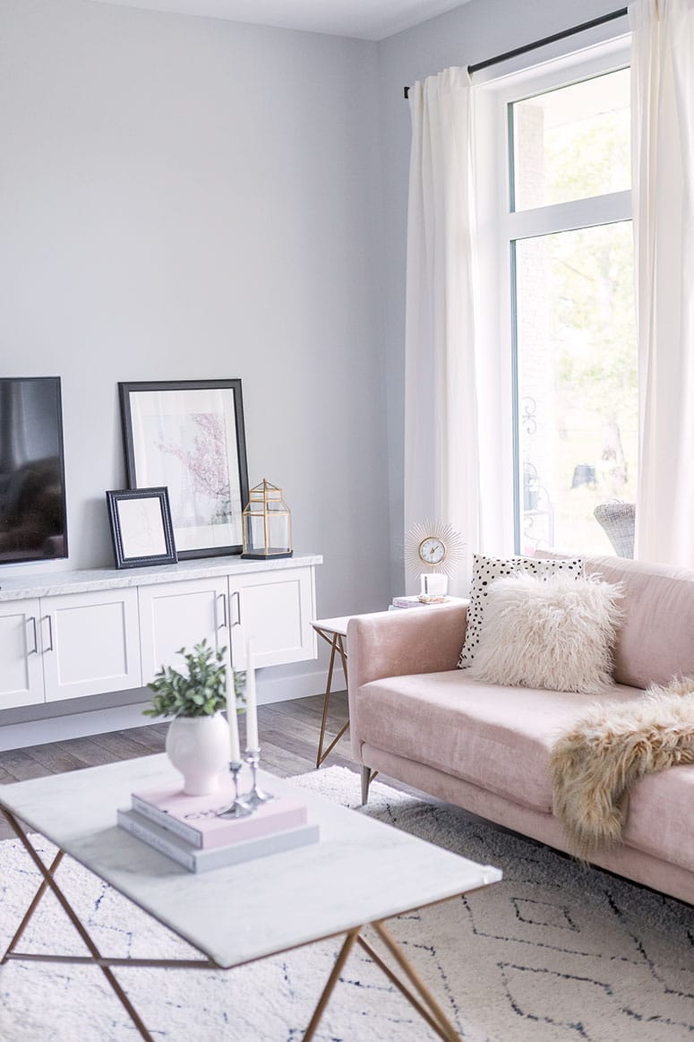 Small living room furniture arrangement idea with sofa and TV unit.