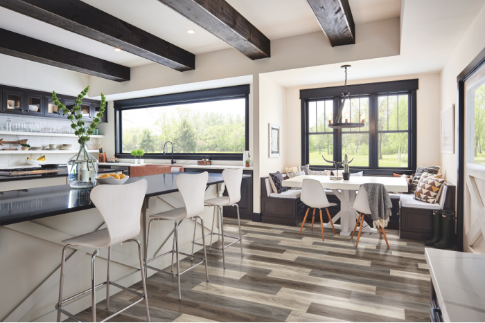 Kitchen luxury vinyl tile flooring looks like hardwood.