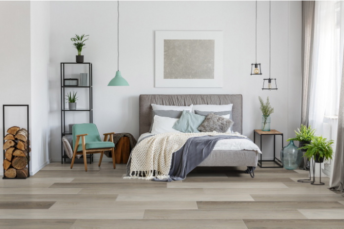 Bedroom luxury vinyl tile flooring looks like hardwood.