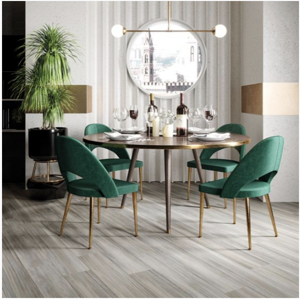 Modern dining with room luxury vinyl tile flooring looks like hardwood. The long planks help make this dining room look bigger.