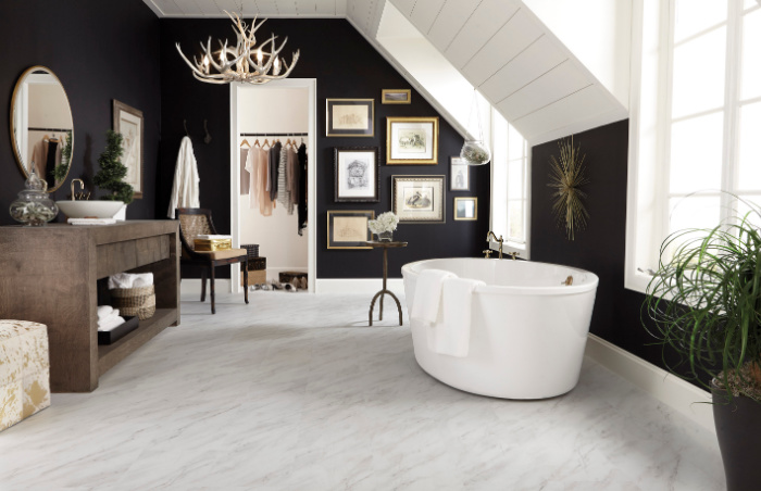 Bathroom luxury vinyl tile flooring looks like marble.