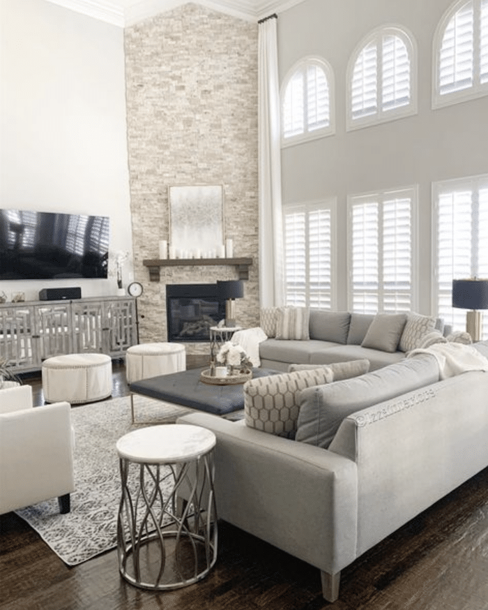 How To Arrange Furniture Around A Corner Fireplace - Living Room Ideas. Sectional sofa, 2 chairs and tv unit and corner fireplace furniture arrangement.