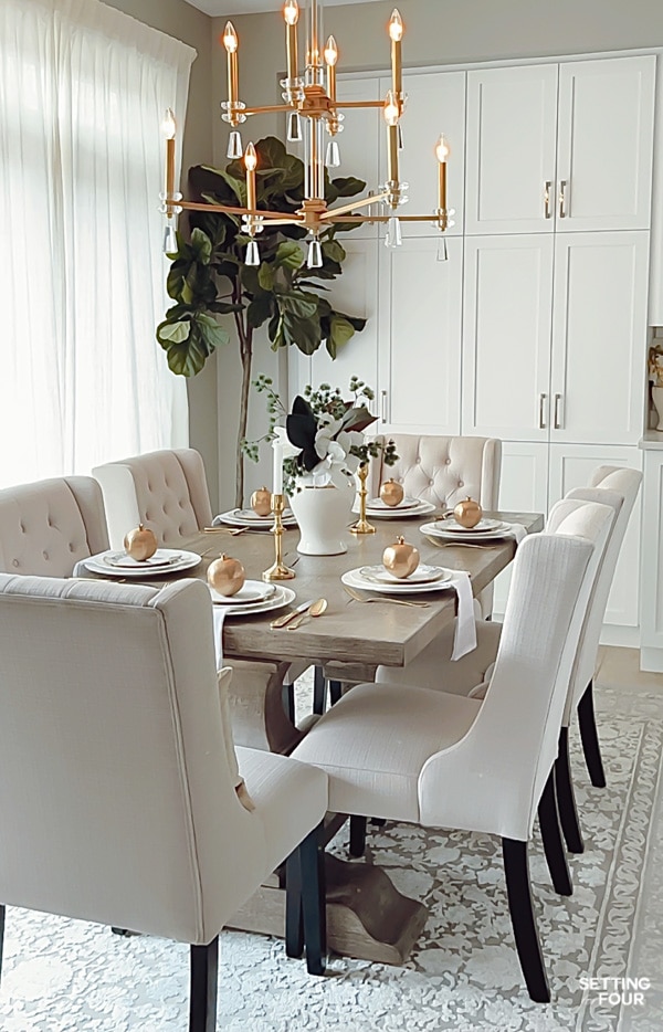Simple, elegant Christmas dining room decor ideas, centerpiece, place settings.