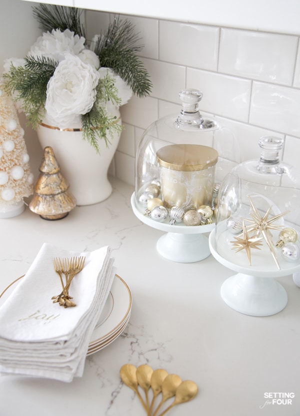 Elegant Christmas kitchen countertop decor ideas with cake stand displays.