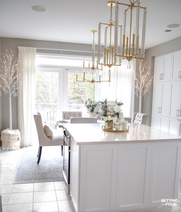 Elegant White & Gold Christmas Kitchen Decor Ideas.White kitchen decorated for Christmas. Kitchen island decor ideas for the holidays.