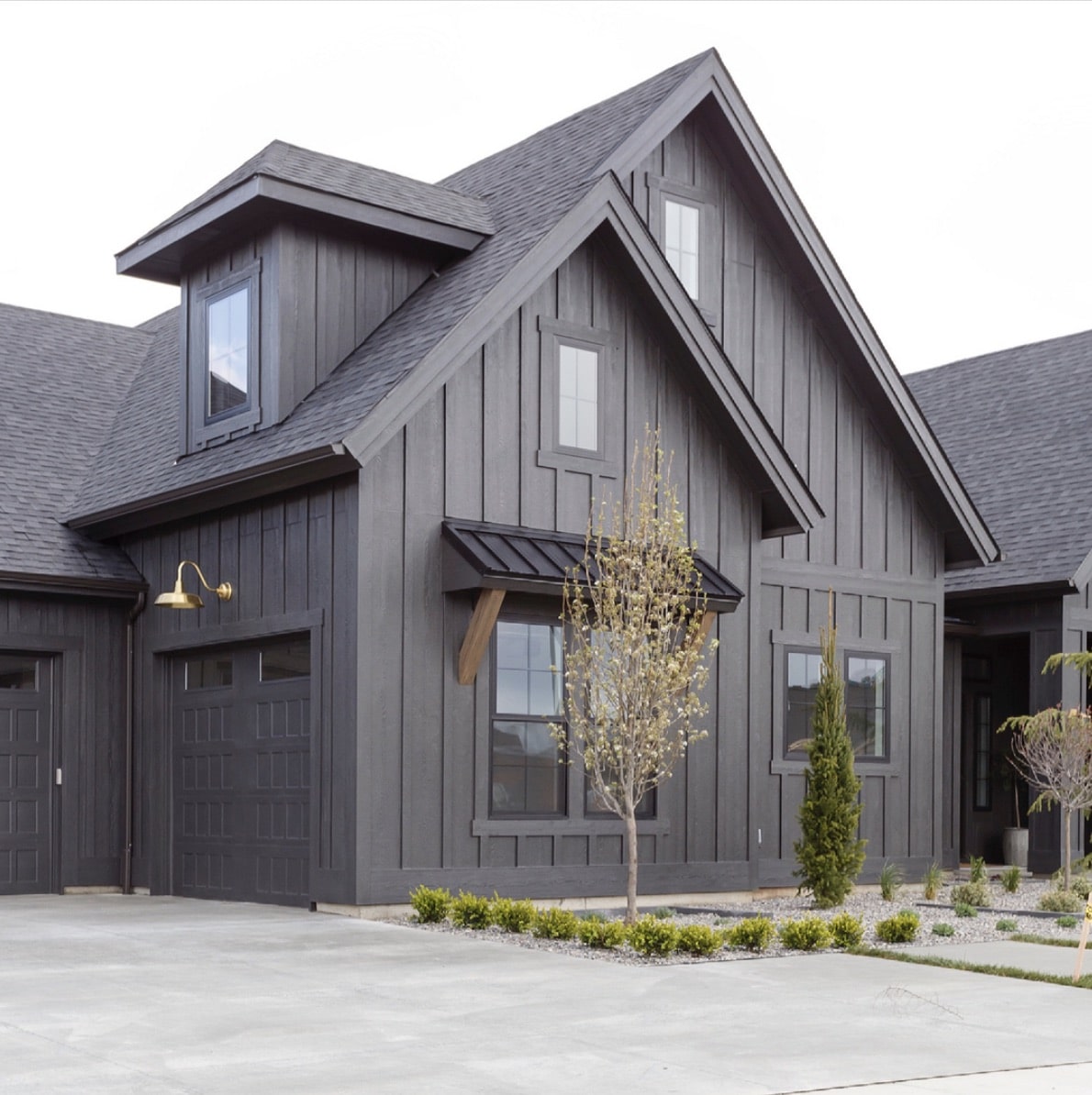 Sherwin Williams Iron Ore Exterior Paint Color. black exterior color, siding color, farmhouse, modern, transitional, design ideas, exterior color scheme, palette, minimalist, simple, dramatic, 