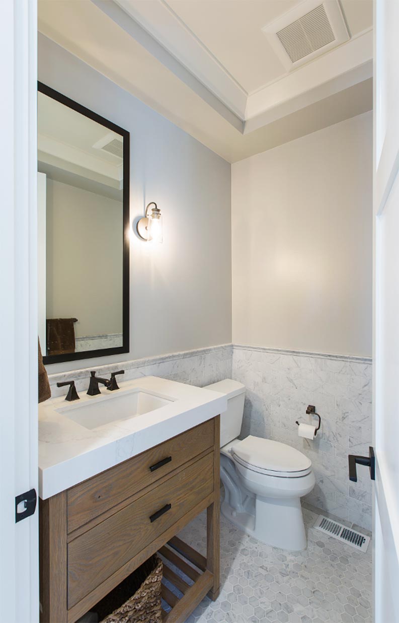 Sherwin Williams Repose Gray bathroom paint color idea with marble tile.