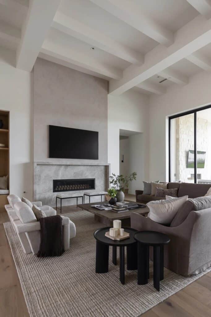 Cozy Great Room Furniture Arrangement With A Sectional Sofa and 2 Chairs, living room design ideas, modern, minimalist, traditional, Nancy Meyers style, neutral aesthetic, earthy color palette, new home ideas, white ceiling beams and plaster fireplace idea, 2026 trends
