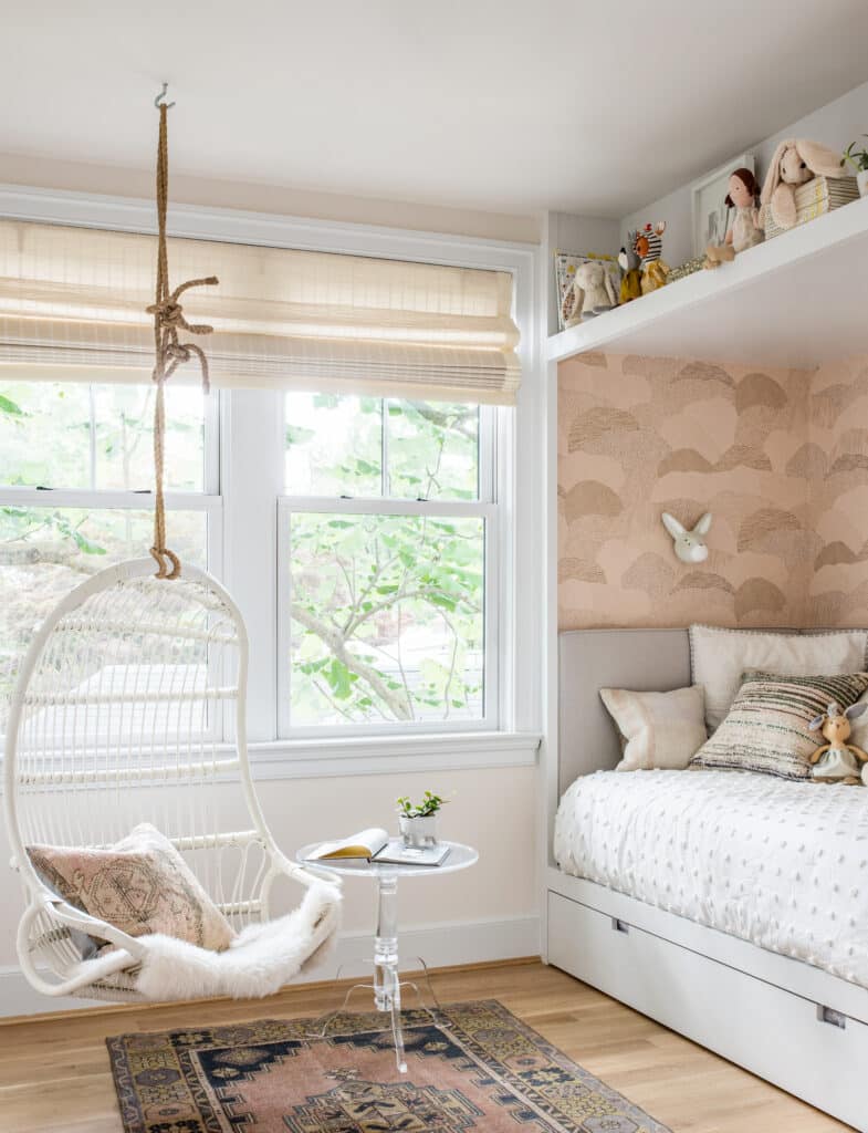 For small kids rooms a twin trundle bed with a shelf above for toy storage and display is a beautiful idea! small bedroom inspiration, toy storage idea, hanging chair, cozy bedroom for children and teens, pink and white color palette, modern, transitional home ideas