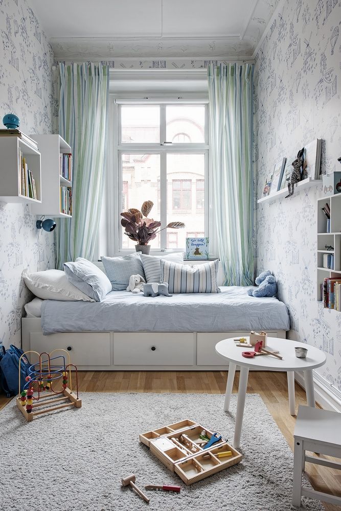 Small Kids Bedroom Design, Organization and Decor Ideas,
This twin bed with drawers placed under the window is a beautiful reading nook and cozy for sleeping and naps! Lots of wall shelves, picture ledges and wall cubes store toys and books leaving the floor open for a small play table and room to play on the floor. tiny home inspiration, apartment bedroom inspo