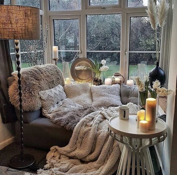 How To Create A Cozy Nook - Design and Decor Ideas. cozy window seat nook with pillows and throw blankets.