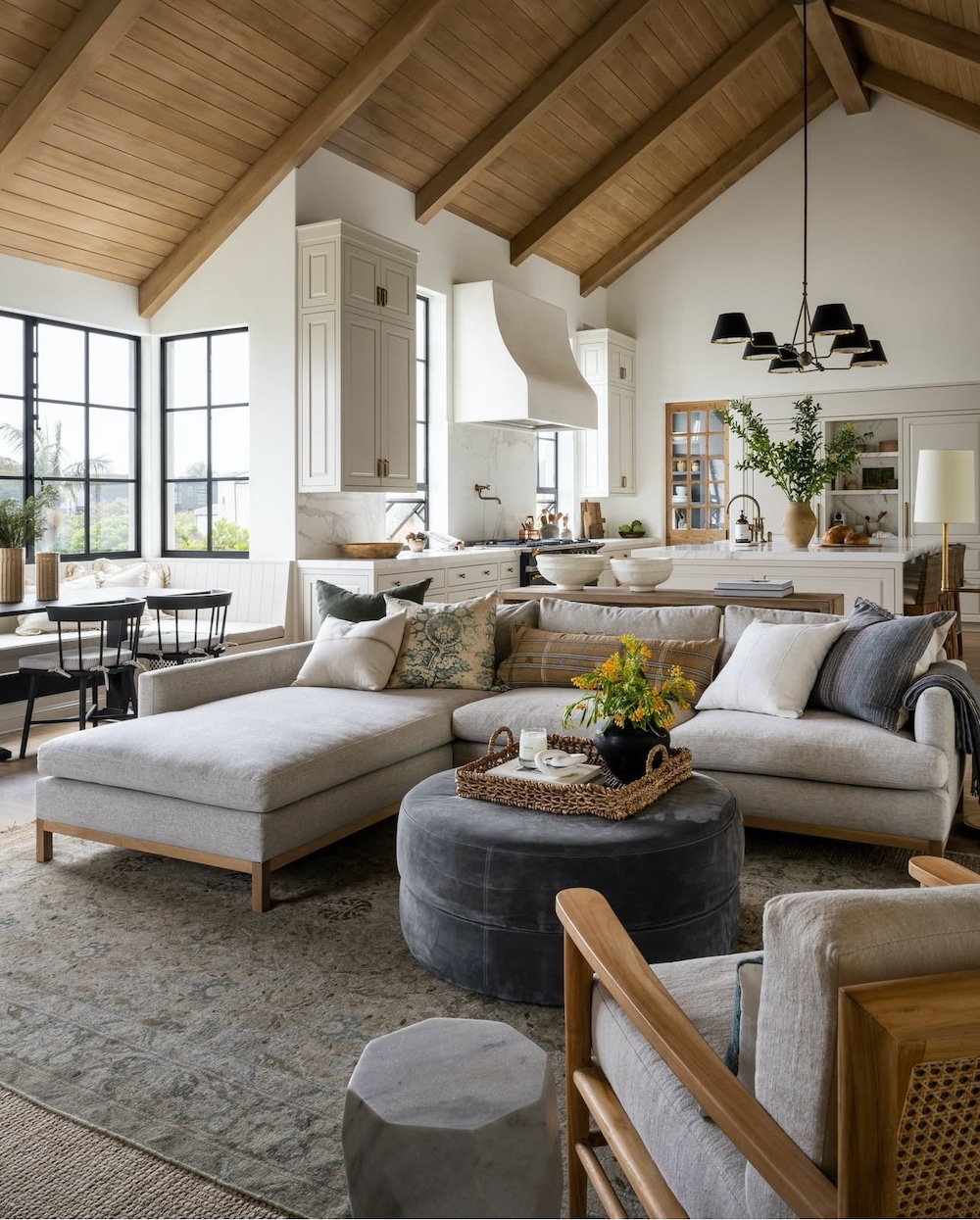 Decorating Ideas For Open Concept Living Room Dining Room and Kitchen Ideas, furniture layout ideas open home layout, arrangement, cohesive, flow, wood ceiling with beams, white walls, black, sectional sofa with a chair, organic modern, minimalist, transitional, new build home inspiration, cozy, earthy, moody, elegant decor ideas, 2025 and 2026 design trends
