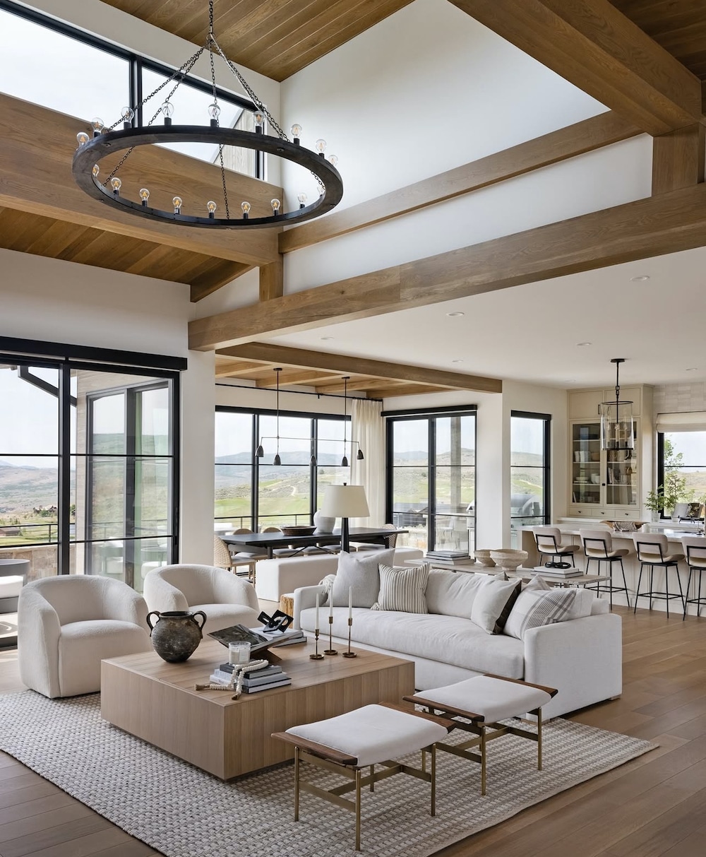 Open Concept Living Room, Dining Room, Kitchen Furniture Arrangement Ideas, tall ceilings, sofa with 2 chairs and square coffee table, two ottomans, wood ceiling, black living room chandelier, furniture placement that flows, cohesive, new home construction inspiration, black windows, white oak, light wood floors, vaulted ceiling, black and white color palette, neutral color scheme, earthy, modern, transitional, minimalist, farmhouse interior design ideas