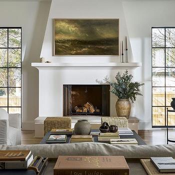 Samsung The Frame TV Hung Over A White Plaster Fireplace with Mantle, tv looks like art, minimalist, modern, transitional, vintage landscape art, sofa facing TV, black windows that go to the floor, cottage, country home, new home ideas, living room remodel, cozy, earthy, Studio McGee, amber interiors style, 2026 trend, organic, natural, living room decorating ideas