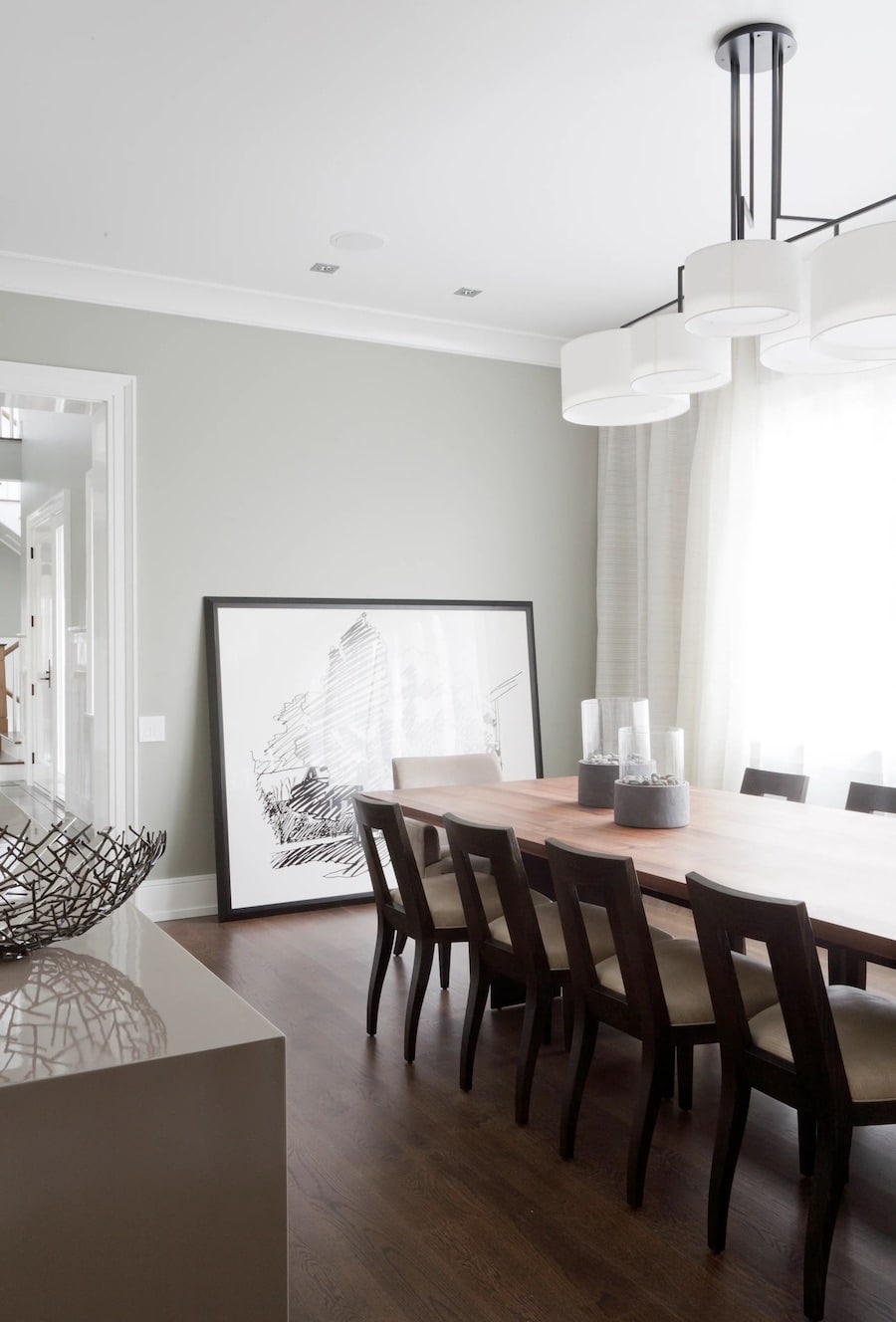 Sherwin Williams Repose Gray Dining Room Paint Color Inspiration, warm, earthy color palette, griege, cozy, wood dining table with wood chairs, black and white art, modern, transitional, brown wood floors