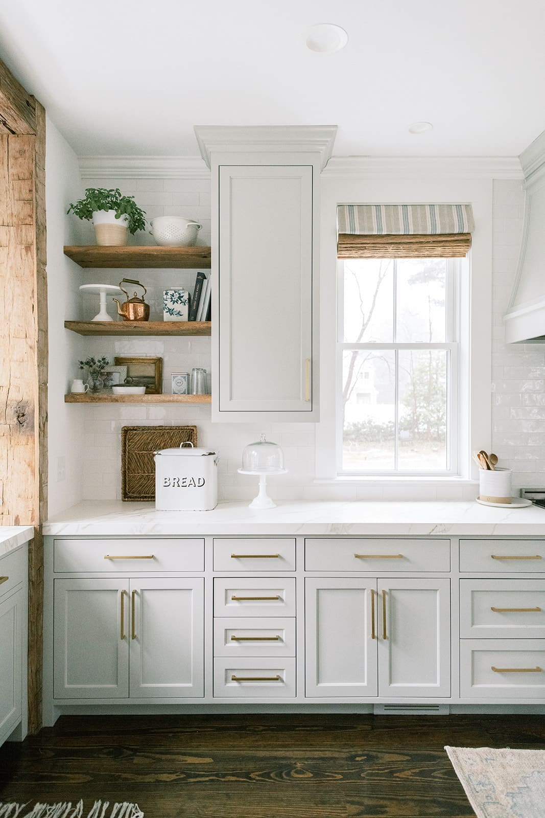 Sherwin Williams Repose Gray Kitchen Cabinet Paint Color Idea, greige, neutral color, cozy, warm, inviting, kitchen decor ideas, traditional, organic modern kitchen with floating shelves and subway tile backsplash, farmhouse kitchen, rustic, reclaimed wood trim, interior design ideas