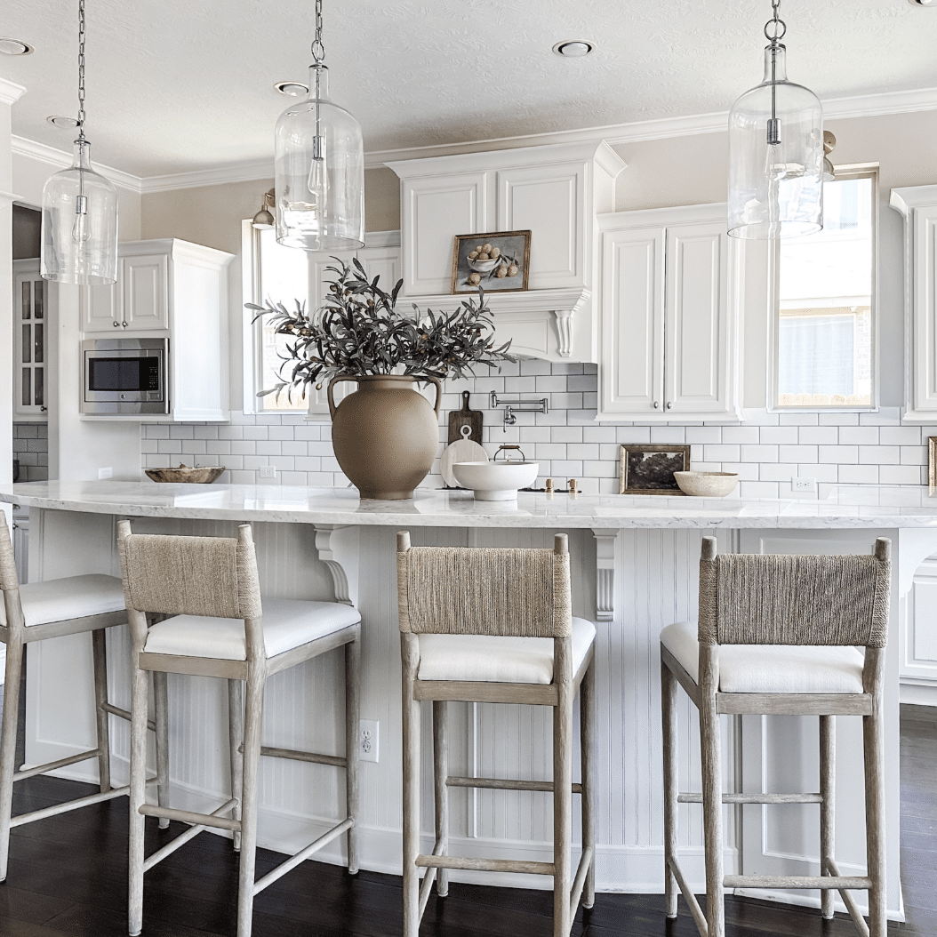 Sherwin Williams Repose Gray Kitchen Wall Paint Color Idea, greige and white kitchen, woven kitchen island counter stools, bright, cozy, organic modern, transitional design inspiration, new home ideas, 2026 trends