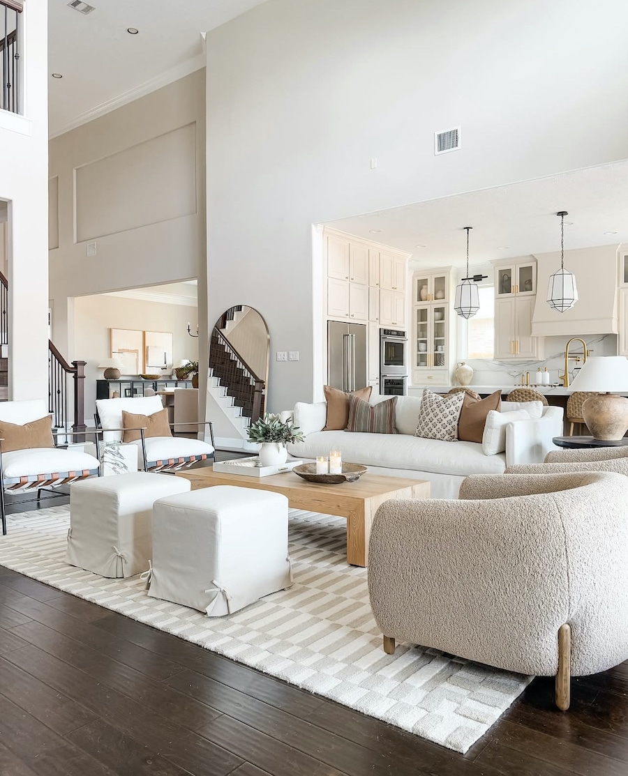 Sherwin Williams Repose Gray Great Room Paint Color Idea, living room wall color, whole house paint color, greige, neutral color palette, warm color scheme, organic modern, transitional home interior design inspiration, dark brown wood floors, tall ceilings, open concept living room and kitchen furniture arrangement layout ideas, 2025, 2026 trends