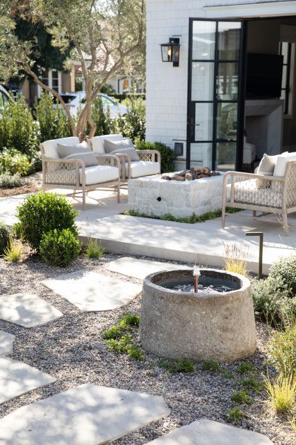 Elegant Neutral Outdoor Patio Decor Ideas. water fountain, garden, firepit, gravel patio, cozy, relaxing decor ideas, modern, minimalist, farmhouse, transitional