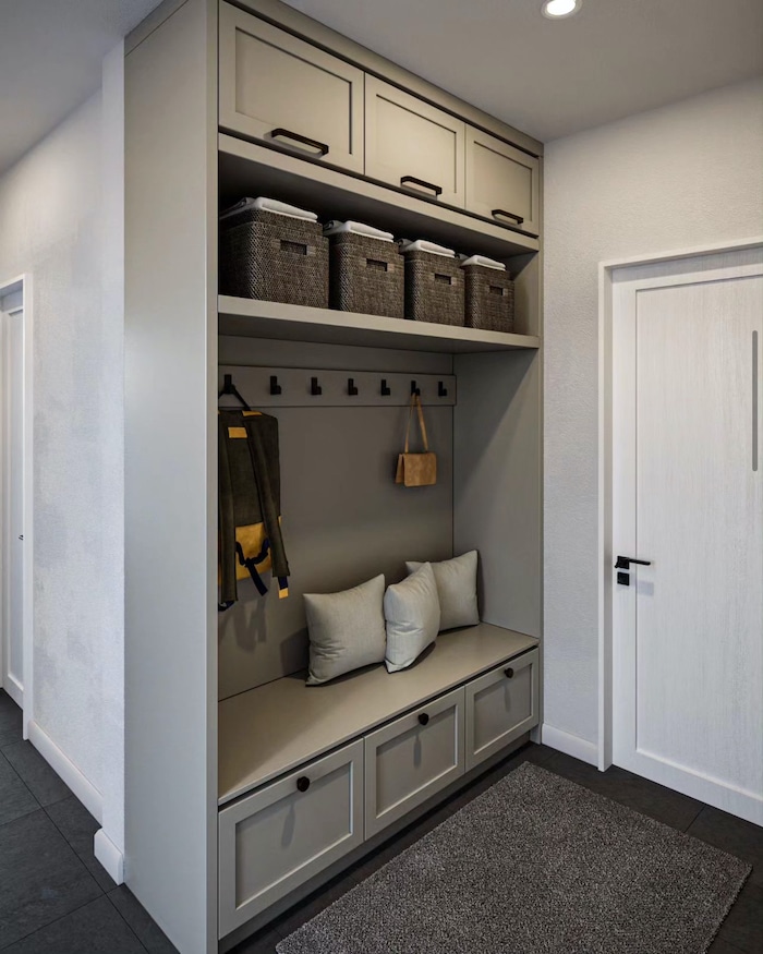 Neutral Entryway Built In Cabinets & Storage Ideas. Cozy Entryway with lots of organization for backpacks, shoes and coats. Baskets and drawers keep everything tidy and uncluttered.
