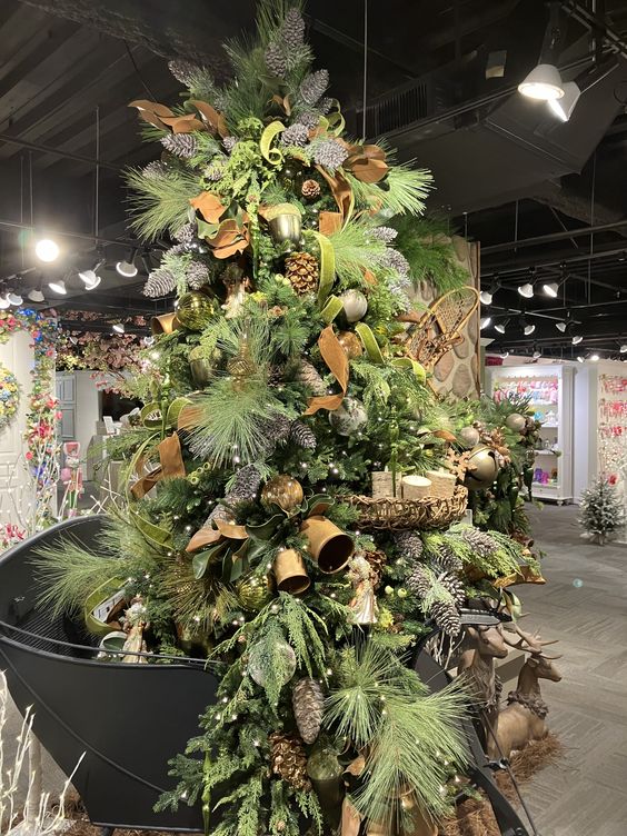 Rustic Elegant Woodland Christmas Tree Decor Ideas. Holiday tree ornaments, garland ideas and more. Natural pine tree with copper ribbon, bells, pinecones.