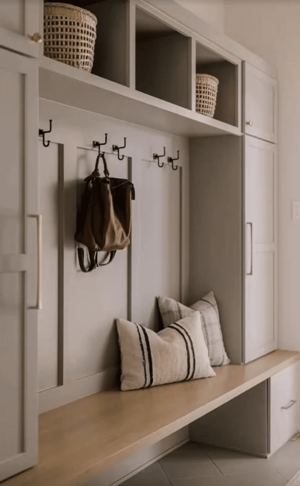 Backpack Storage Solutions - mudroom cabinets with hooks for hanging backpacks, bench, cubbies, drawers and closed cabinets.