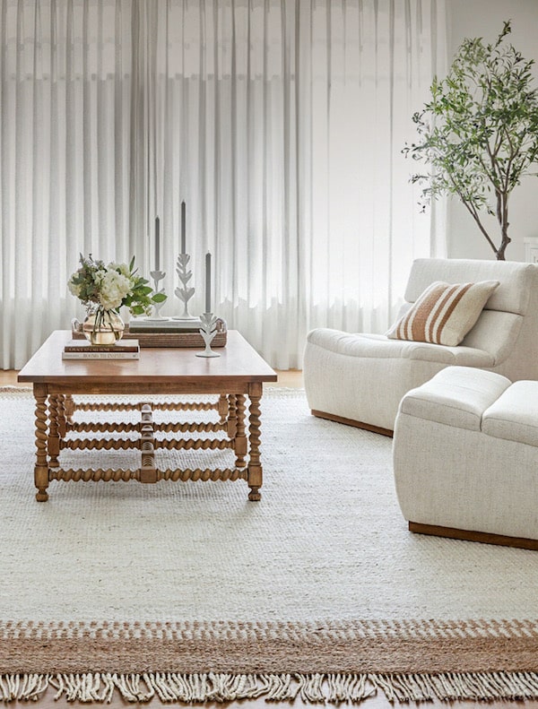 Neutral Living Room Design Inspiration and Decor Ideas. cozy, elegant, modern, transitional, minimalist, natural area rug, coffee table decor, modern chairs, ripple fold drapes, relaxing, calm