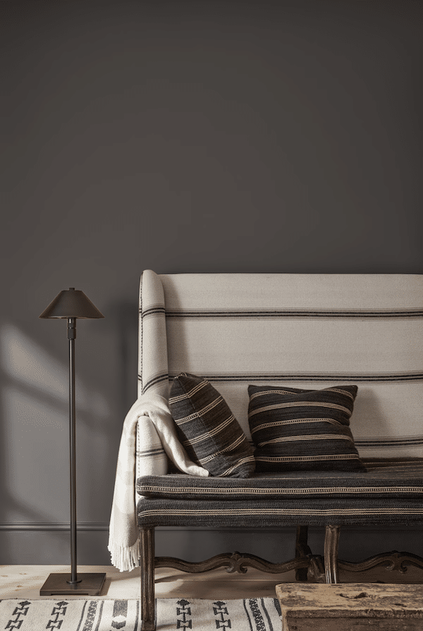 Benjamin Moore Color Of The Year 2026 Silhouette, wall color idea, hallway paint color, entryway, dark, cozy, elegant, organic modern, upholstered bench with black floor lamp, neutral color palette