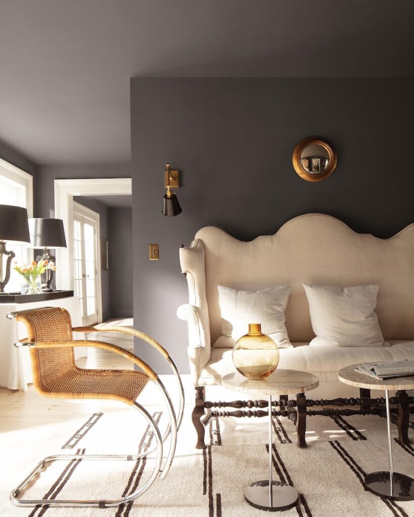 Benjamin Moore Silhouette Living Room Paint Color Idea, color of the year 2026, 2026 design trend, moody, earthy color palette, brown and white, vintage furniture mixed with modern furniture pieces, transitional, home interior