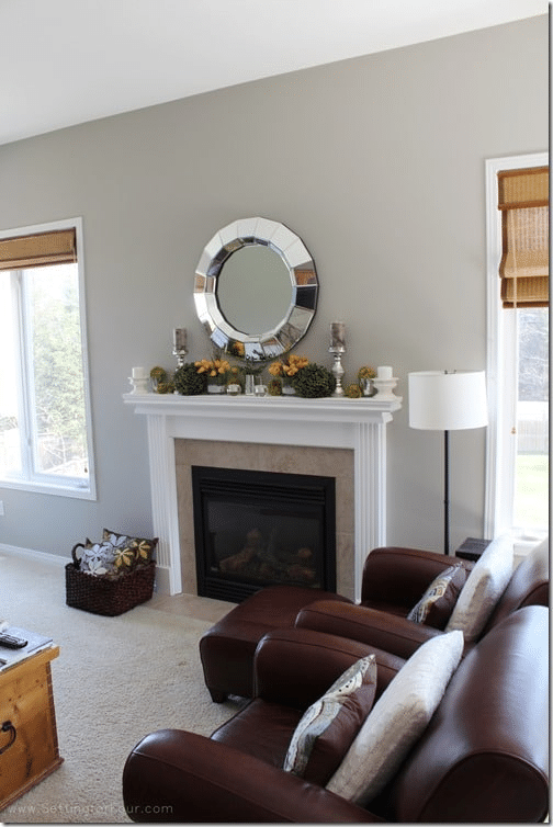 Give a dated wood fireplace a fresh new look with this easy white fireplace mantel makeover! See how painting an orange-toned wood mantel white transformed the fireplace into a bright, timeless focal point. Get the before-and-after reveal, white paint color, supply list and easy step-by-step tips for painting a wood fireplace mantel. Perfect inspiration for an affordable DIY fireplace makeover!