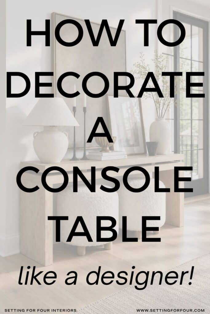 Pinterest graphic reading โHow to Decorate a Console Table Like a Designerโ over a styled white oak console table with artwork, a lamp, greenery and two cream ottomans.